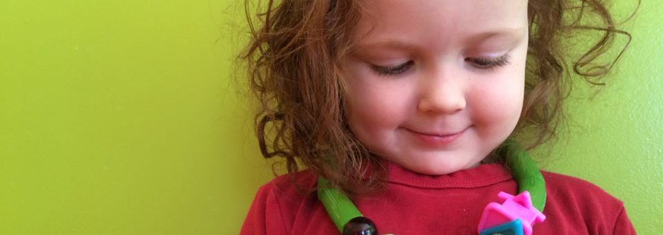 green dyed pasta necklace fine motor skills