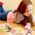 young girl reading national geographic canada facts book weird but true reading learning early literacy pickle planet