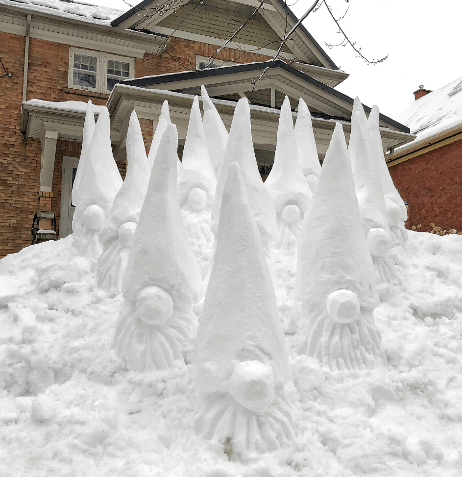 several snow sculpture gnomes by matt morris 