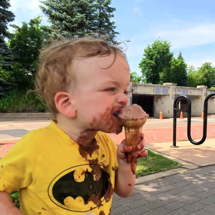 little boy enjoying a messy ice cream cone in moncton new brunswick