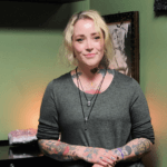 professional piercer ashley hannington in her relaxing green studio room at scarlet ink tattoo parlour riverview new brunswick