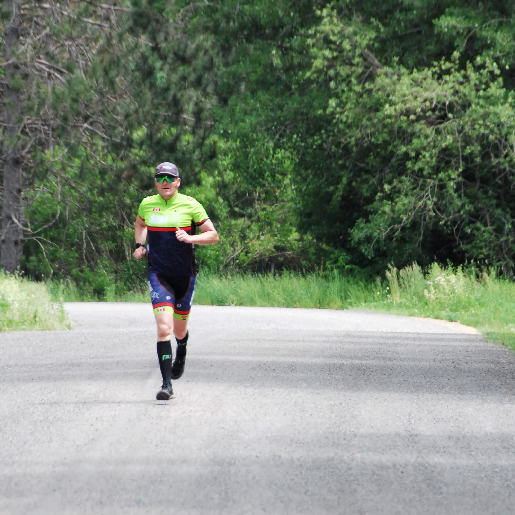 triathlete running on dirt road